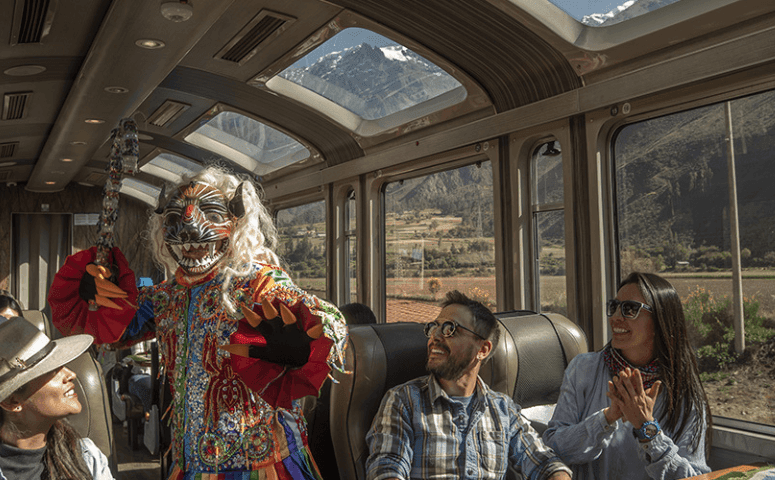 travelers sitting in the train with panoramic windows and are enjoying the onboard show