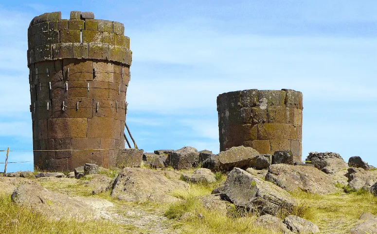 Two ancient towers are standing next to each other Lake Titicaca Peru with Exploor Peru