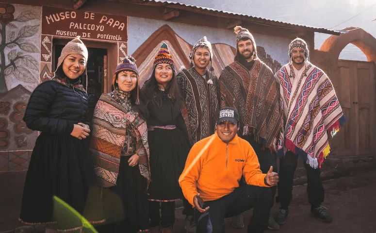 Travelers in traditional clothes Peru with Exploor Peru