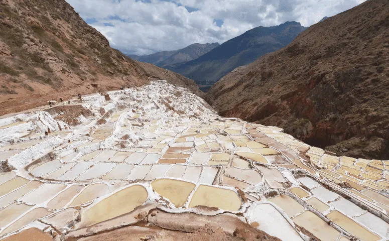 Hundreds of salt ponds surrounded by mountains Machu Picchu Peru with Exploor Peru