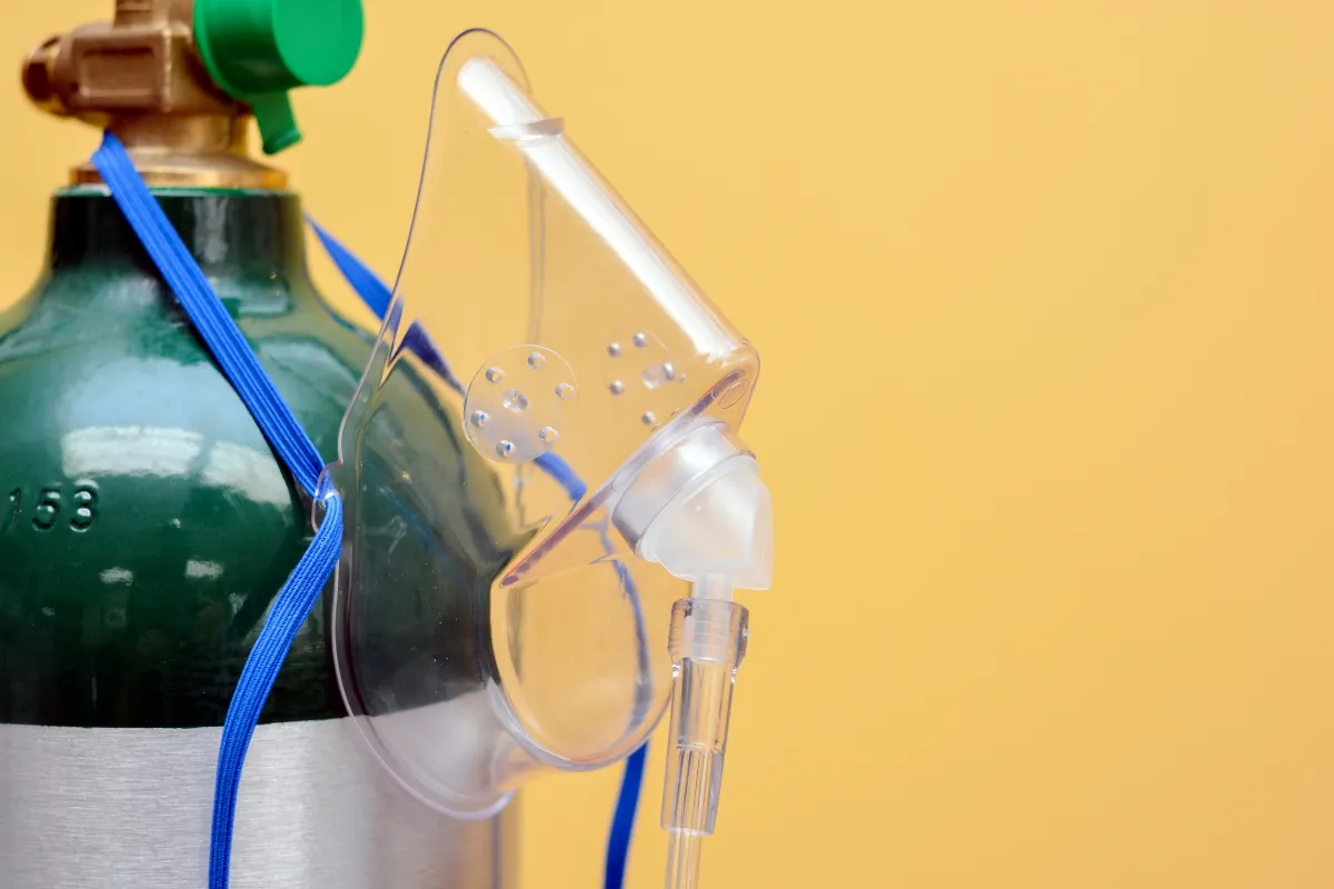 Portable oxygen tank and mask for travelers experiencing altitude in Cusco