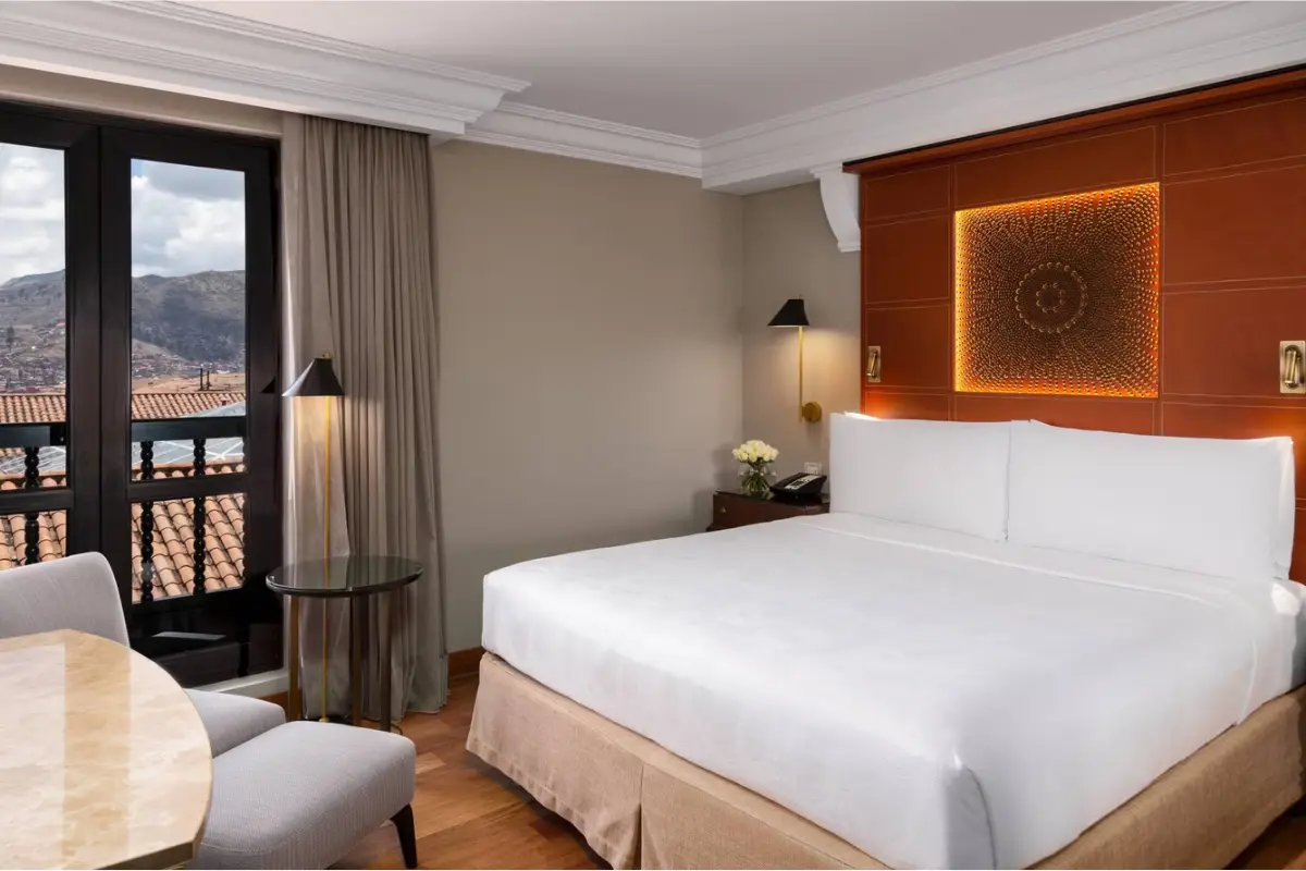 Luxury hotel room in Cusco with views of the surrounding Andes